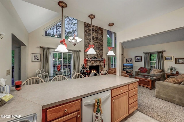 107 Musket Dr, Lackawaxen, PA 18435 - kitchen with open floor plan, light countertops, high vaulted ceiling, a stone fireplace, and plenty of natural light