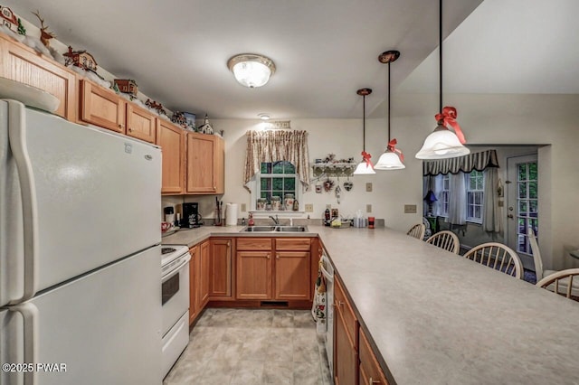 107 Musket Dr, Lackawaxen, PA 18435 - kitchen featuring white appliances, a kitchen breakfast bar, hanging light fixtures, light countertops, and a peninsula