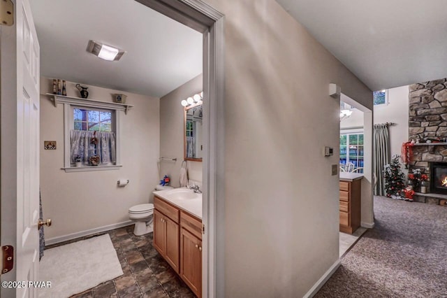 107 Musket Dr, Lackawaxen, PA 18435 - bathroom featuring baseboards, toilet, vanity, and healthy amount of natural light