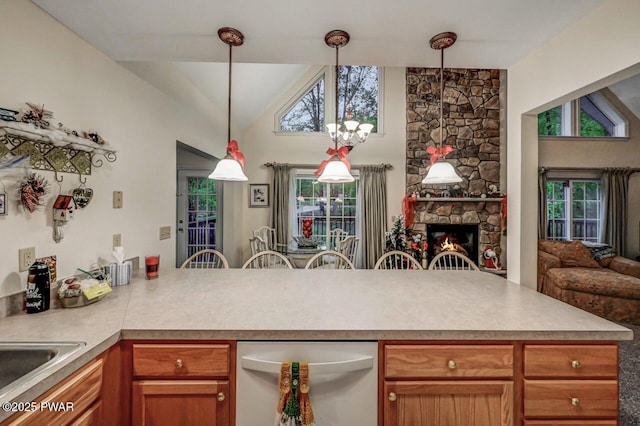 107 Musket Dr, Lackawaxen, PA 18435 - kitchen with open floor plan, a peninsula, white dishwasher, light countertops, and high vaulted ceiling
