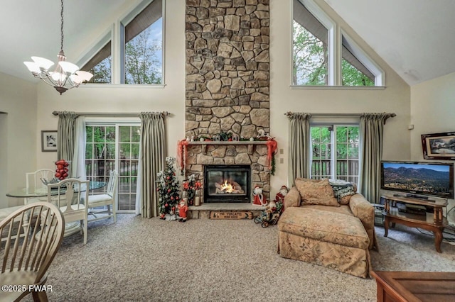 107 Musket Dr, Lackawaxen, PA 18435 - living room with high vaulted ceiling, carpet flooring, a chandelier, plenty of natural light, and a stone fireplace