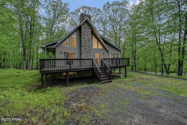 107 Musket Dr, Lackawaxen, PA 18435 - view of front of house with a wooden deck and a chimney