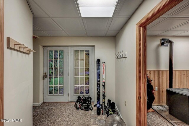 107 Musket Dr, Lackawaxen, PA 18435 - doorway with a wood stove and carpet flooring