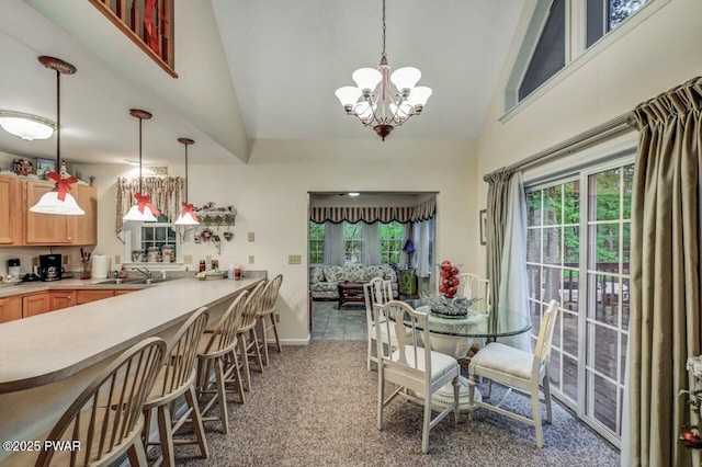 107 Musket Dr, Lackawaxen, PA 18435 - carpeted dining room featuring high vaulted ceiling, healthy amount of natural light, a chandelier, a sink, and baseboards