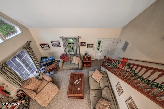 107 Musket Dr, Lackawaxen, PA 18435 - carpeted living area featuring healthy amount of natural light and stairway