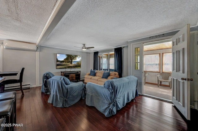 living area featuring a wealth of natural light, baseboard heating, a wall unit AC, and wood-type flooring