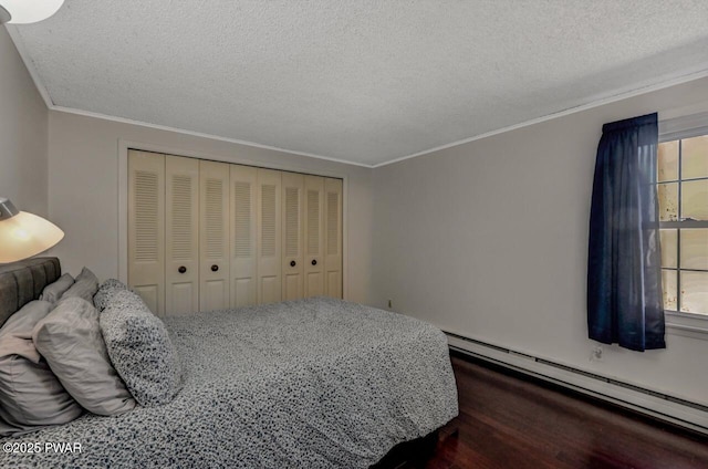 bedroom with multiple windows, baseboard heating, and crown molding