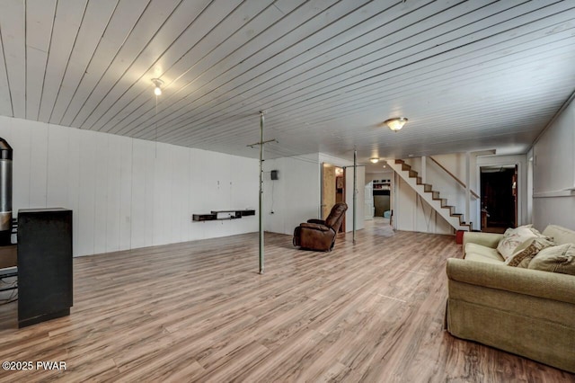 interior space featuring wood finished floors and stairs