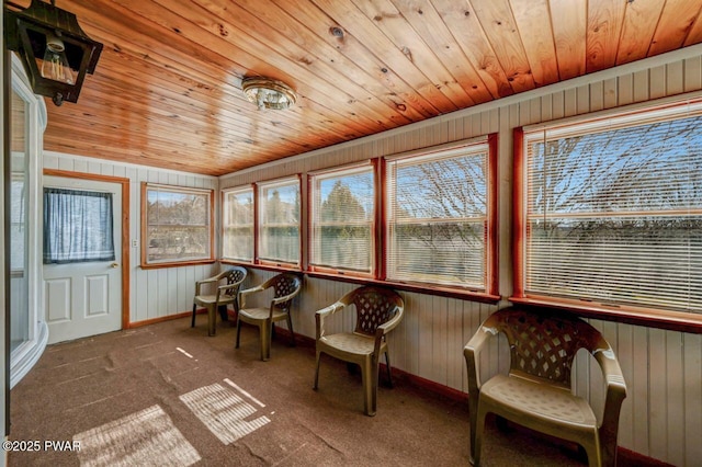 sunroom featuring a wealth of natural light and wooden ceiling