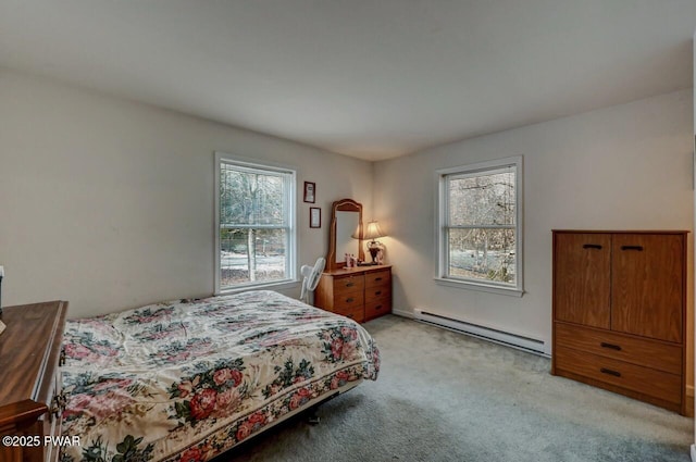 carpeted bedroom featuring baseboard heating