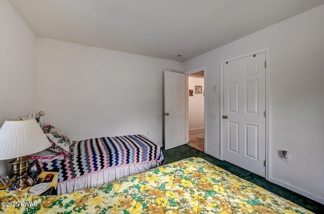 bedroom featuring dark colored carpet