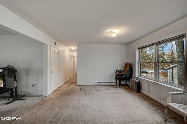 interior space with baseboard heating, radiator, and light carpet