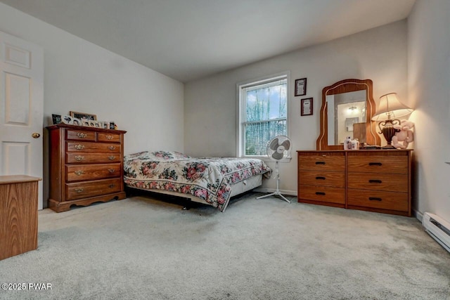 bedroom featuring a baseboard radiator and light colored carpet