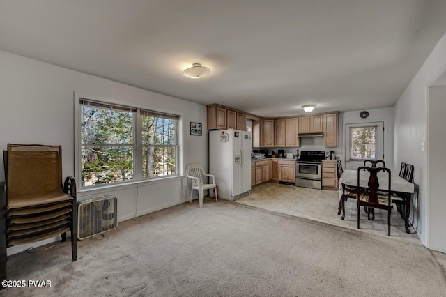 kitchen with light colored carpet, stainless steel range with electric cooktop, and white fridge with ice dispenser