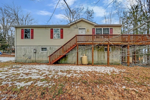 back of house featuring a deck