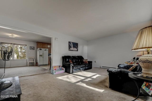 living room with a baseboard radiator and light carpet