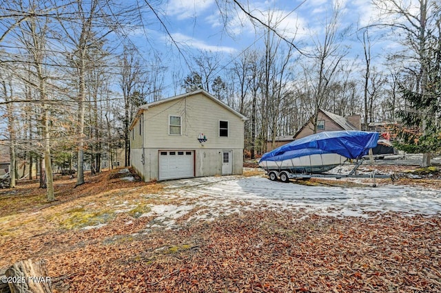 snow covered property featuring a garage