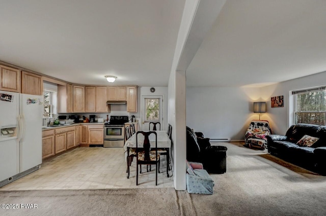 kitchen with sink, stainless steel range with electric cooktop, white refrigerator with ice dispenser, light colored carpet, and light brown cabinets