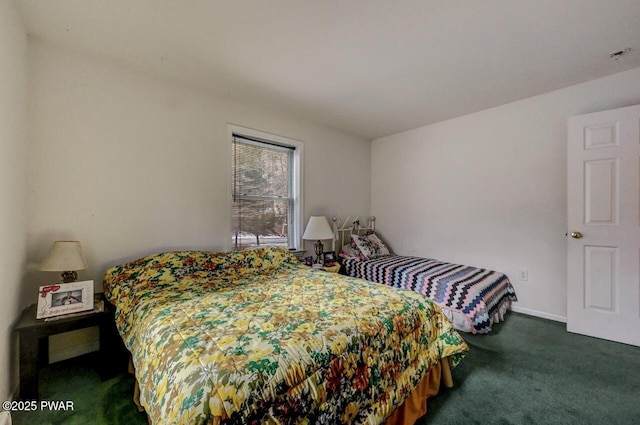 bedroom featuring dark colored carpet