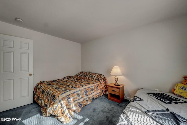 bedroom featuring dark carpet