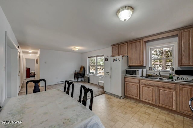 kitchen with sink and white appliances