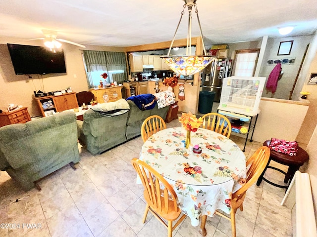 dining space featuring ceiling fan and a healthy amount of sunlight