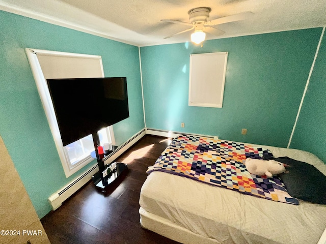 bedroom with ceiling fan and a baseboard radiator