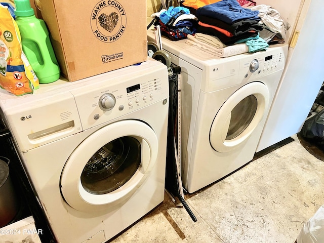 clothes washing area featuring washer and dryer