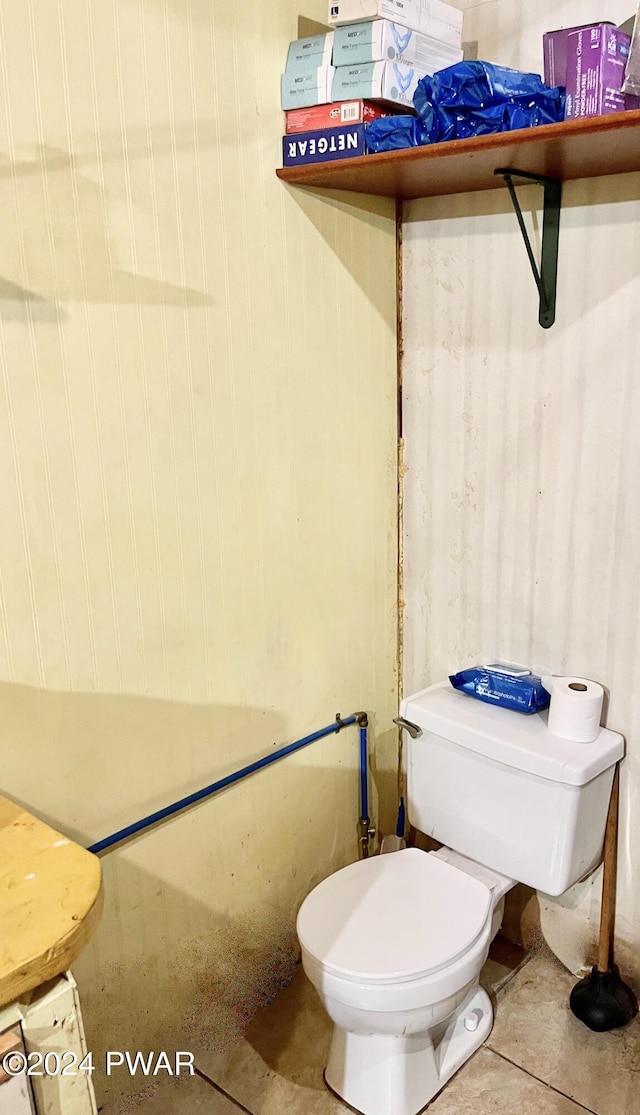 bathroom featuring tile patterned floors and toilet