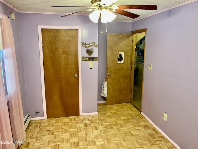 interior space with a textured ceiling, light parquet floors, baseboard heating, and ceiling fan