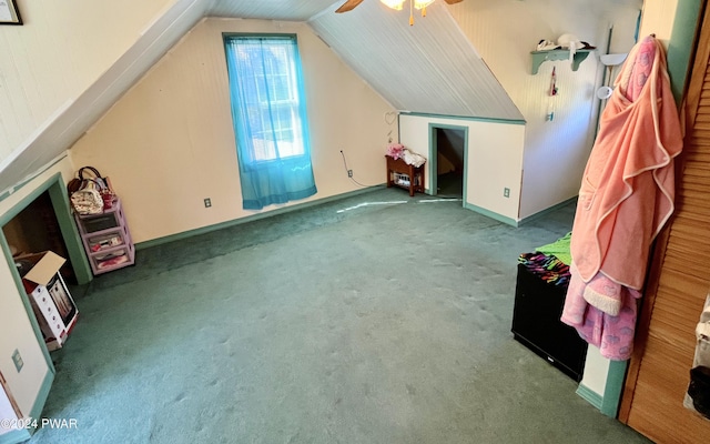 additional living space with carpet, ceiling fan, and lofted ceiling