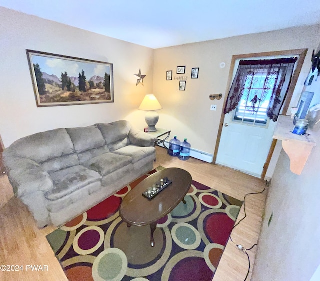 living room featuring wood-type flooring and a baseboard radiator