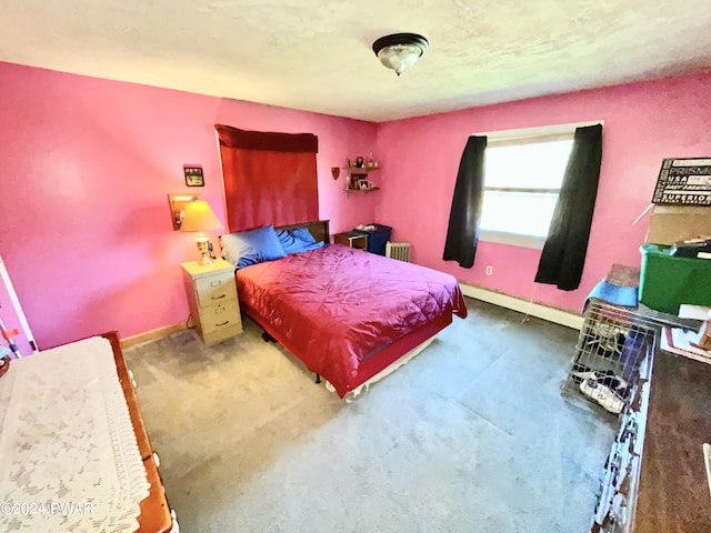 bedroom with a baseboard radiator and radiator