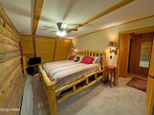 carpeted bedroom featuring wood walls, log walls, and ceiling fan