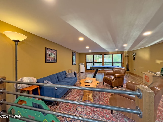 living room featuring hardwood / wood-style floors and pool table