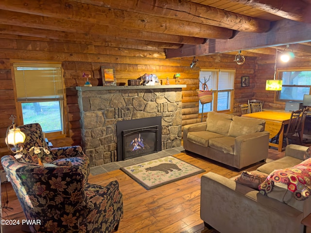 living room with beam ceiling, log walls, wooden ceiling, hardwood / wood-style floors, and a fireplace