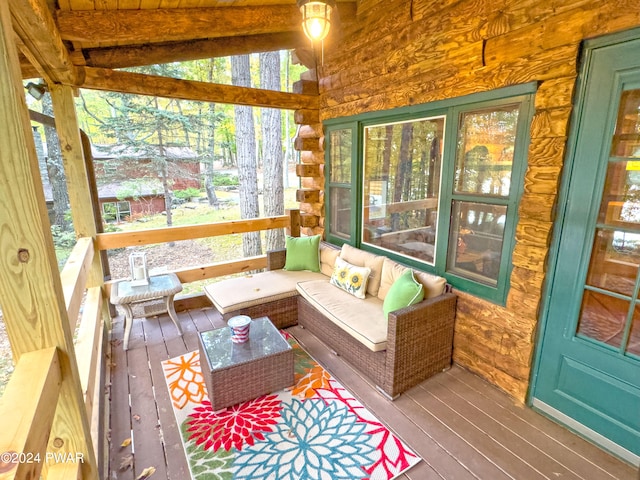 sunroom / solarium with vaulted ceiling with beams and wooden ceiling