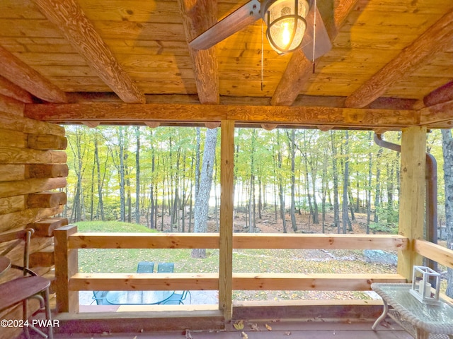 interior space featuring beamed ceiling and wooden ceiling