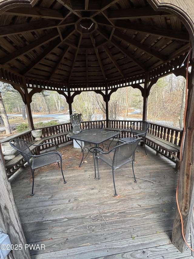 wooden terrace featuring a gazebo