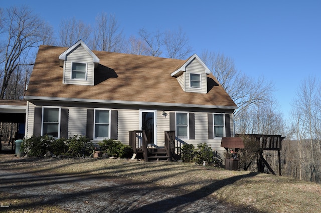 cape cod home with a tile roof