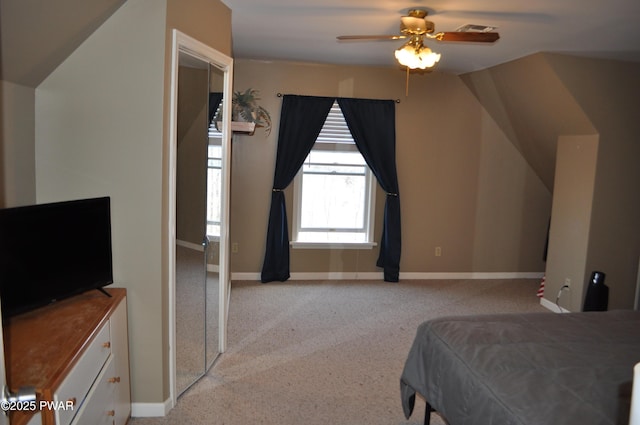 bedroom featuring a ceiling fan, light colored carpet, visible vents, and baseboards