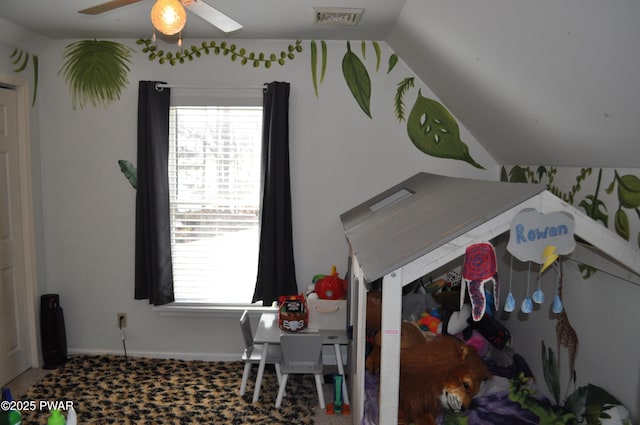 interior space featuring visible vents, vaulted ceiling, a wealth of natural light, and a ceiling fan