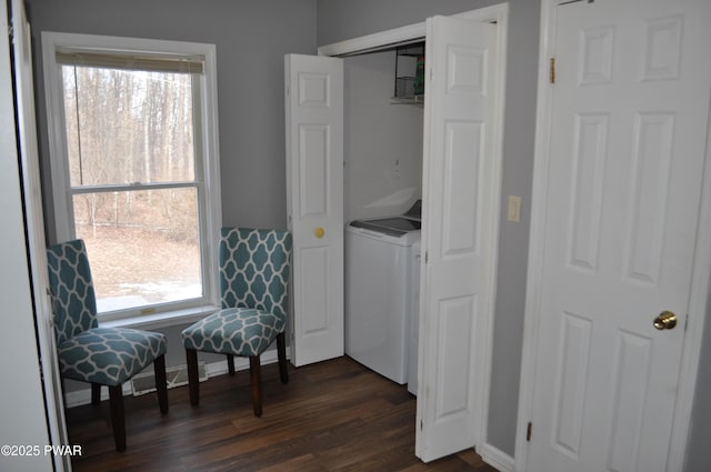 clothes washing area featuring visible vents, laundry area, dark wood-type flooring, and washer / dryer