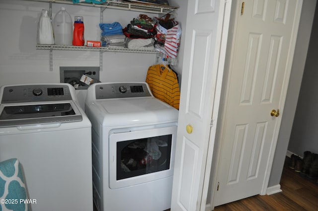 washroom featuring dark wood finished floors, laundry area, and independent washer and dryer