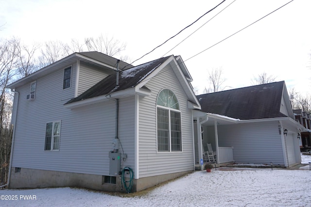 view of side of home with a garage