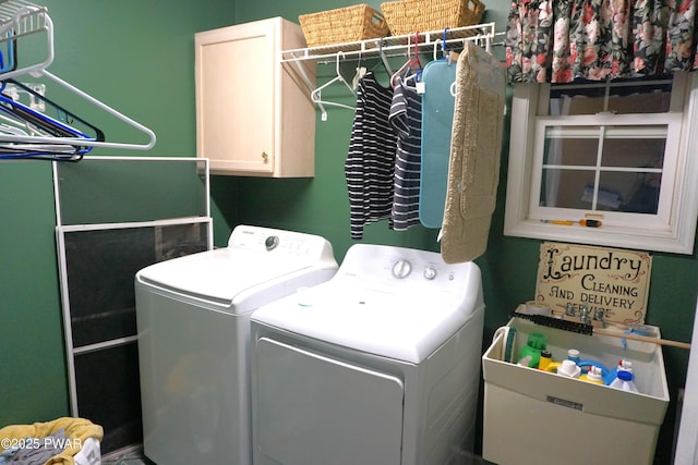 laundry room with cabinets and washer and dryer