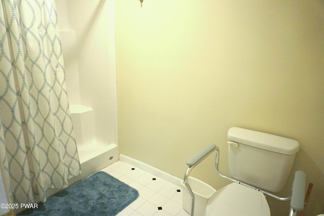 bathroom with tile patterned floors and toilet