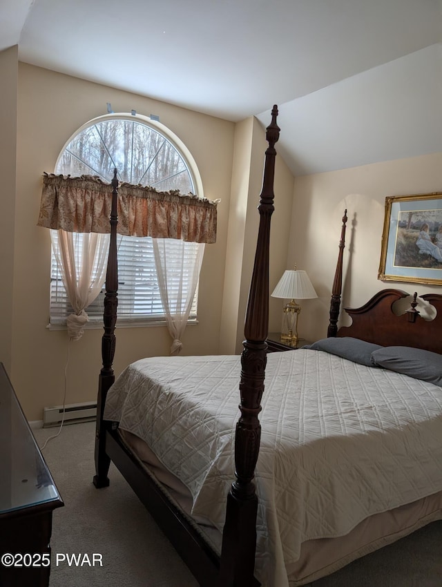 carpeted bedroom with lofted ceiling and a baseboard radiator