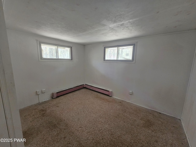 118 Tulip St, Dingmans Ferry, PA 18328 - carpeted empty room featuring baseboard heating and a textured ceiling