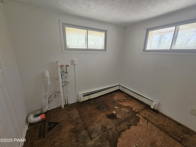 118 Tulip St, Dingmans Ferry, PA 18328 - spare room featuring healthy amount of natural light and a baseboard heating unit